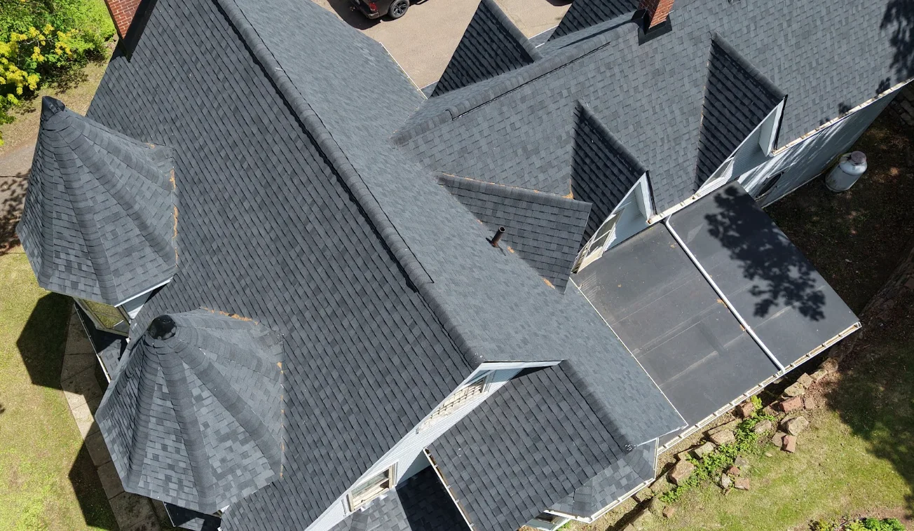 Finished charcoal architectural shingle roof on a Sackville home, photographed by drone