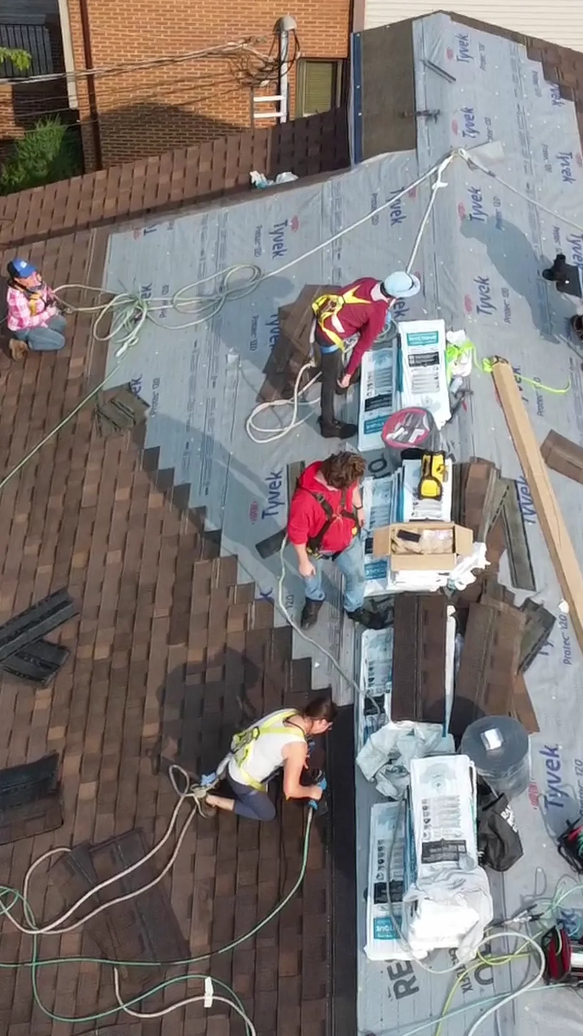 Four Plus Ultra crew working a roof together
